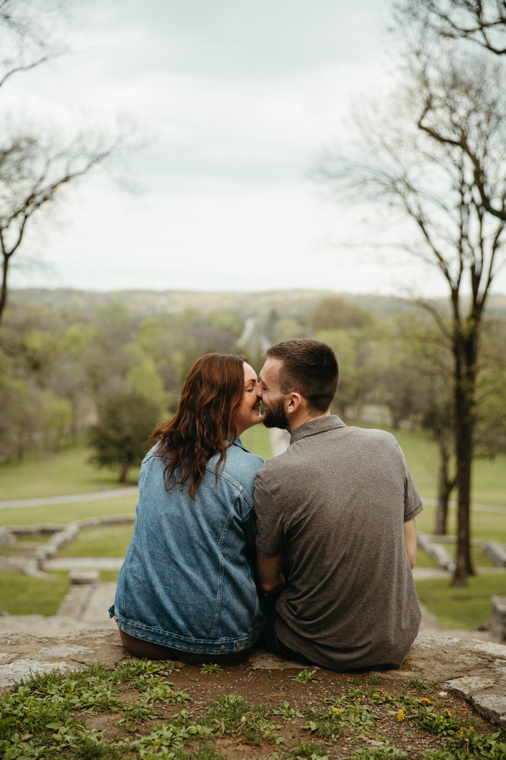 couple taking proposal photos at percy warner steps in brentwood tennessee close to nashville tennessee