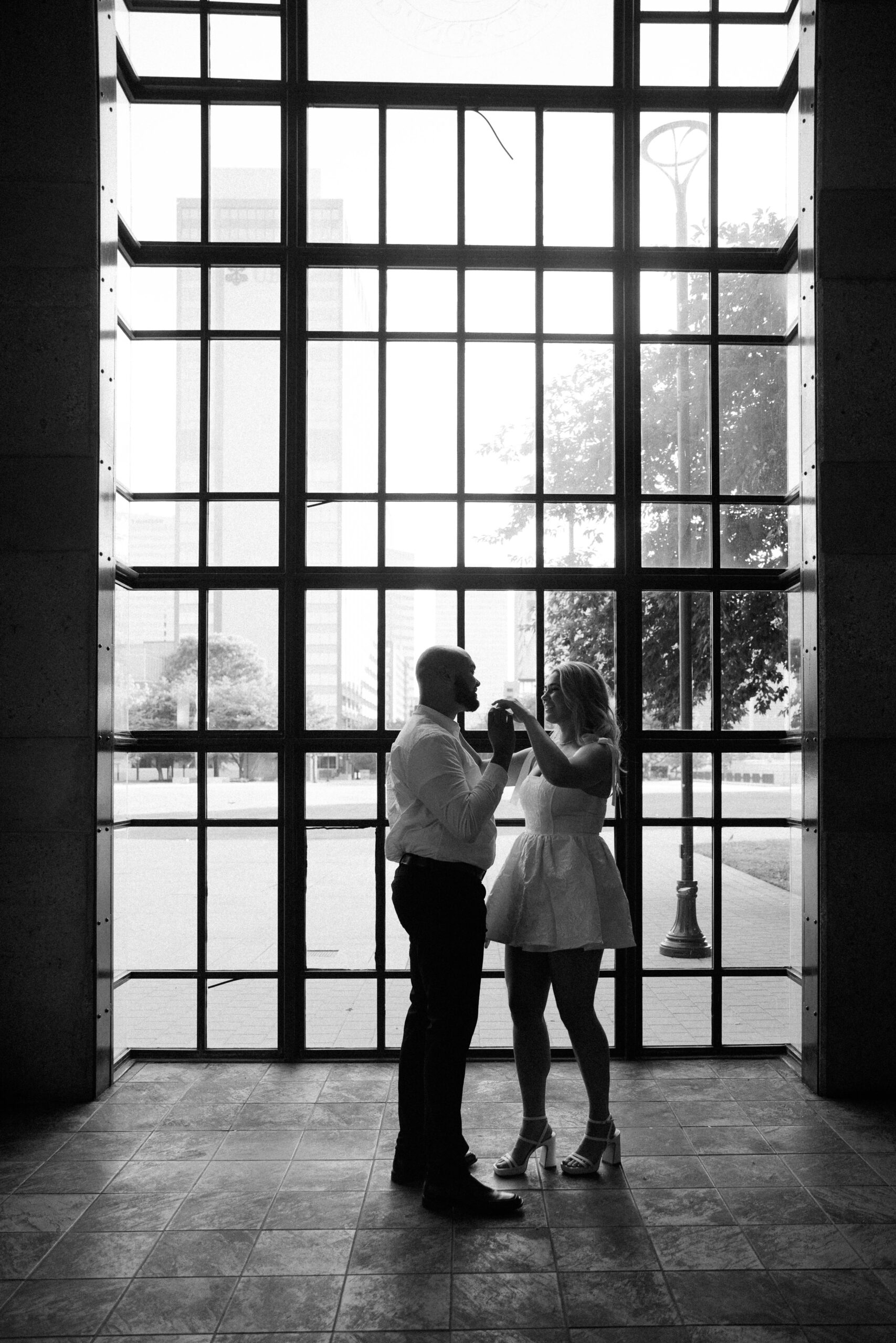 couple getting engagement photos done  at public square park in nashville, tennessee